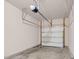 Spacious garage with concrete floor and white garage door; plenty of room for storage at 9805 Precious Stone Dr, Wake Forest, NC 27587