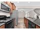 Kitchen with breakfast bar, stainless appliances, and open floor plan at 9805 Precious Stone Dr, Wake Forest, NC 27587