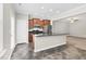 Open kitchen with stainless steel appliances and breakfast bar at 9805 Precious Stone Dr, Wake Forest, NC 27587