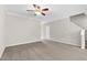 Carpeted living room with ceiling fan and white walls at 9805 Precious Stone Dr, Wake Forest, NC 27587