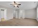 Spacious main bedroom featuring neutral paint, ceiling fan, carpet and access to the walk-in closet at 9805 Precious Stone Dr, Wake Forest, NC 27587
