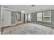 Spacious basement featuring stairs, a large rug, and an open floor plan at 1001 Tender Dr, Apex, NC 27502