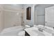 A tidy bathroom with a shower and tub combination, and a white vanity at 1001 Tender Dr, Apex, NC 27502