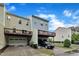 Exterior of townhomes with deck access from the second story, and driveway car parking at 1001 Tender Dr, Apex, NC 27502
