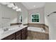 This bathroom has double sinks, a large soaking tub, and a tiled backsplash at 1001 Tender Dr, Apex, NC 27502