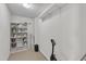 Well-lit storage room with shelves, paint cans, and cleaning equipment, providing ample storage at 1001 Tender Dr, Apex, NC 27502