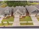 An aerial view of homes showcasing manicured lawns and complementing exterior colors at 1009 Middleground Cir, Durham, NC 27713