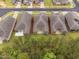 Aerial view of modern homes with patios, lawns and tree-lined landscape at 1009 Middleground Cir, Durham, NC 27713