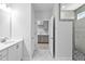 Elegant bathroom with white marble floors and countertops, double sinks, and a shower to create a sleek design at 1009 Middleground Cir, Durham, NC 27713