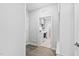 Hallway view of laundry area with modern washer and dryer at 1009 Middleground Cir, Durham, NC 27713