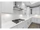 Bright kitchen featuring a gas range cooktop, stainless steel appliances, and white subway tile at 1009 Middleground Cir, Durham, NC 27713