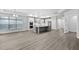 Bright open floor plan featuring a modern kitchen and spacious living area with ample sunlight at 1009 Middleground Cir, Durham, NC 27713