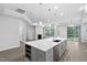 Open concept kitchen flows into the living area with fireplace and leads to outdoor patio at 1009 Middleground Cir, Durham, NC 27713