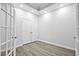 A bright office space with glass french doors, recessed lighting, and hardwood floors at 1009 Middleground Cir, Durham, NC 27713