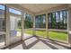 Screened porch with natural light and wooded backyard view at 1009 Middleground Cir, Durham, NC 27713