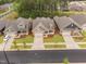 Street view of modern homes with manicured lawns and attached garages at 1009 Middleground Cir, Durham, NC 27713