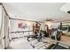 Basement workout area with weight machine, fireplace, and neutral carpet at 106 Shady Point Ct, Durham, NC 27713