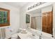 Bright bathroom with natural light, featuring a large mirror and a classic, clean design at 106 Shady Point Ct, Durham, NC 27713