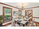 Dining room with natural light and wood floors adjacent to the stairs at 106 Shady Point Ct, Durham, NC 27713