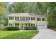 Charming two-story home with a well-manicured lawn and attached two-car garage at 106 Shady Point Ct, Durham, NC 27713