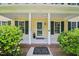 Charming covered porch with a welcome mat, decorative plant, and house number at 106 Shady Point Ct, Durham, NC 27713