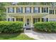 Inviting front porch with classic columns and lush landscaping for curb appeal at 106 Shady Point Ct, Durham, NC 27713