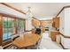 Kitchen with wood cabinets, stainless appliances, and adjacent dining area at 106 Shady Point Ct, Durham, NC 27713