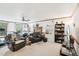 Cozy living room with a fireplace, comfortable seating, and a built-in bookcase at 106 Shady Point Ct, Durham, NC 27713