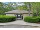 Pool entrance with signage, hedges, fencing, and a pool house at 106 Shady Point Ct, Durham, NC 27713