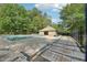 Community pool surrounded by lounge chairs and lush greenery, creating a relaxing atmosphere at 106 Shady Point Ct, Durham, NC 27713