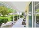 Spacious porch with ample seating and views of the surrounding greenery at 106 Shady Point Ct, Durham, NC 27713