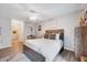 Bright bedroom featuring a wooden bed frame, contemporary decor, and an ensuite bathroom at 107 Sturbridge Dr, Clayton, NC 27520