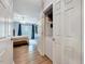 View of bedroom with closet and ceiling fan from an adjacent doorway at 107 Sturbridge Dr, Clayton, NC 27520