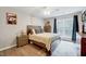 Inviting bedroom with a comfortable bed, stylish decor, and plenty of natural light from the large window at 107 Sturbridge Dr, Clayton, NC 27520
