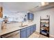 The kitchen features white countertops, a breakfast bar, and seamless open access to the living area at 107 Sturbridge Dr, Clayton, NC 27520