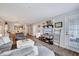 Comfortable living space with a TV, stylish decor, and an open view into the dining and kitchen areas at 107 Sturbridge Dr, Clayton, NC 27520