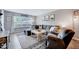 Comfortable living room with plush sectional sofa, stylish rug, and lots of natural light at 107 Sturbridge Dr, Clayton, NC 27520