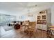 Bright open-concept living space with dining area, cozy seating, and large window at 107 Sturbridge Dr, Clayton, NC 27520
