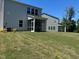Expansive backyard with a screened porch, perfect for outdoor enjoyment at 1080 River Glade Ct # 17, Graham, NC 27253