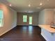Bright, airy living room featuring dark floors, neutral walls and ample natural light at 1080 River Glade Ct # 17, Graham, NC 27253