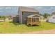 Charming two-story home features a wooden porch and a spacious, well-maintained backyard perfect for outdoor activities at 1112 Prominence Dr, Durham, NC 27712