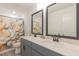 Bathroom with dual sinks, framed mirrors, and a walk-in shower with a decorative curtain at 1112 Prominence Dr, Durham, NC 27712