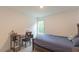 This bedroom features a workstation, neutral walls and a window letting in plenty of natural light at 1112 Prominence Dr, Durham, NC 27712