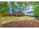 Large backyard featuring a wooden deck with gazebo, grassy area, and privacy fence at 112 Nelson Ln, Clayton, NC 27527
