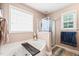 Bright bathroom featuring a soaking tub with wood caddy and glass enclosed shower at 112 Nelson Ln, Clayton, NC 27527