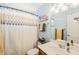 Cozy bathroom featuring a single sink, shower curtain, and essential amenities at 112 Nelson Ln, Clayton, NC 27527