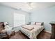 Bright bedroom featuring carpet, a window for natural light, and classic design elements at 112 Nelson Ln, Clayton, NC 27527