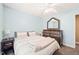 Bright bedroom featuring carpet, a window for natural light, and classic design elements at 112 Nelson Ln, Clayton, NC 27527