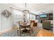Bright dining area featuring a round table, decorative rug, and a seamless transition to the living room at 112 Nelson Ln, Clayton, NC 27527