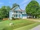 Charming two-story home with inviting front porch, white trim, and manicured lawn at 112 Nelson Ln, Clayton, NC 27527